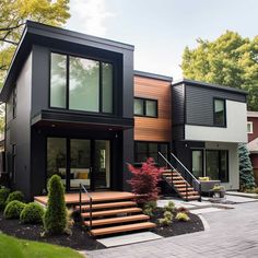 a modern house with stairs leading up to it