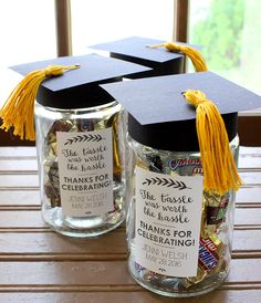 graduation party planning with stamps and tags in mason jars on a table next to a window