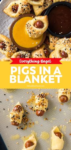 pigs in a blanket with dipping sauce on top and other appetizers around it