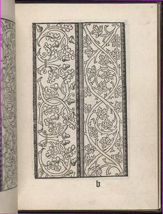 an open book with floral designs on it