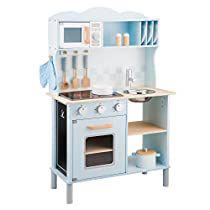 a wooden play kitchen with blue cabinets and white walls