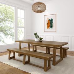 a wooden table and benches in a room