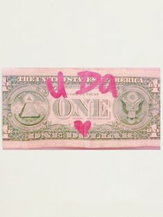 a one dollar bill with pink writing on it