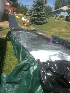 an inflatable pool is being installed on the lawn