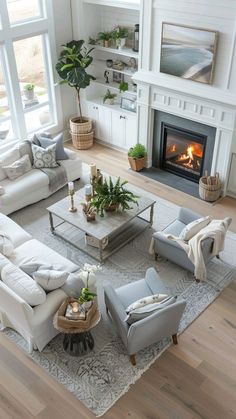 a living room filled with furniture and a fire place in the middle of the room