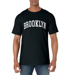 PRICES MAY VARY. Brooklyn - Throwback Design Lightweight, Classic fit, Double-needle sleeve and bottom hem Casual Fitted T-shirt With Team Name, Urban Fitted T-shirt With Letter Print, Basic Streetwear T-shirt With Name Print, Basic Name Print Streetwear T-shirt, Cotton T-shirt With Name Print For Streetwear, New York T Shirts Ideas, Brooklyn T Shirt Design, New York Graphic Tee, New York City Sweatshirt