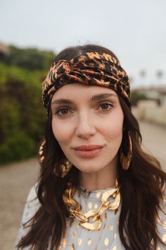 This turbanesque twist headband was handmade in San Diego using an ultra luxe rayon stretch velvet. Pair it with jeans and a striped tee for a casual look, or top off your floor-length bohemian gown for the ultimate luxe look! Machine wash cold, gentle cycle, and lay flat to dry. Trendy Fitted Headwrap Headband, Trendy Fitted Headband Headwrap, Trendy Spring Turban, Trendy Spring Turban Headband, Bohemian Gown, Twist Headband, Stretch Velvet, Style Expert, Hair Accessories Headbands