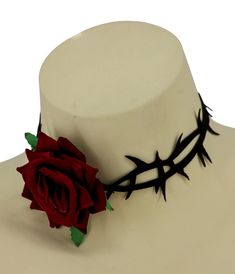 Beautiful and angsty, this darling choker is absolutely a must with its red rose center and captivating black thorns. Complete with a lobster clasp.Available while supplies last.This is a Special Order item, please allow a 2-3 day handling time. Black Rose Accessories, Red Flower Choker, Thorn Accessories, Earthy Dress, Black Thorns, Unusual Accessories, Rose Accessories, Black And Red Roses, Rose Thorns