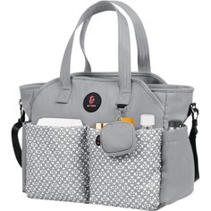 a gray and white purse with two pockets on the front, one is holding an infant bottle