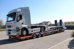 a large semi truck is parked in a lot