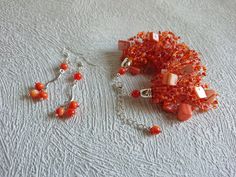 Orange jewelry set for bridesmaid, Statement crocheted jewelry set of 3, Airy beaded necklace, Mother in law gift idea for wife/sister/mom. Orange necklace, bracelet and earrings with mother of pearls chips and orange czech glass seed beads. This jewelry set is one of my favorite jewelry in all shop - very plentiful and unique! A plentful, beautiful and flexible jewelry set, it will be a great addition to an evening or a wedding gown. It might be a perfect gift for wife, sister, mother, daughter Beaded Round Jewelry Sets For Gifts, Round Beaded Jewelry Sets For Gifts, Wedding Dangle Jewelry With Faceted Beads, Adjustable Dangling Beads Jewelry For Weddings, Orange Jewelry With Large Beads For Gift, Elegant Jewelry Sets With Dangling Beads For Gifts, Faceted Round Beads Jewelry Sets For Gifts, Wedding Jewelry Bracelet With Faceted Beads, Dangling Beads Jewelry Set As A Gift