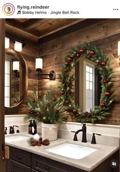 a bathroom decorated for christmas with wreaths and pine cones on the sink counter top