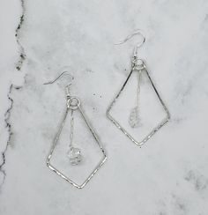 These Herkimer diamond dangle earrings come in 14k gold fill or sterling silver and hammered for texture. They are very light and the perfect amount of beauty and sophistication to go with any outfit. Herkimer Diamond- Attunement, Peace, Visualization  Herkimer diamond heals and balances energy.  It clears the chakras and opens channels for spiritual energy to flow. It stimulates conscious attunement to the highest level. Affirmation - "I clearly manifest my desires" Chakra - crown and third eye Modern Hammered Dangle Jewelry, Hammered Sterling Silver Drop Jewelry, Hammered Drop Sterling Silver Jewelry, Sterling Silver Dangle Earrings With Diamond Cut, Hand Forged Sterling Silver Earrings For Anniversary, Sterling Silver Diamond Cut Chandelier Earrings For Anniversary, Anniversary Diamond Cut Sterling Silver Chandelier Earrings, Anniversary Sterling Silver Diamond Cut Chandelier Earrings, Minimalist Hammered Dangle Earrings