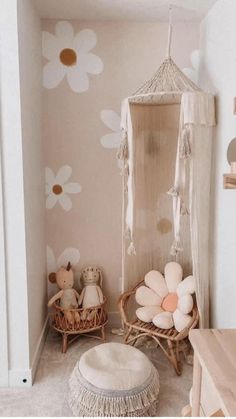 a room with flowers painted on the wall, and a hammock hanging from the ceiling