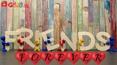 the word friends forever is spelled by wooden letters with hearts in front of colorful wood planks