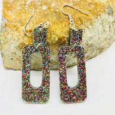 Laser cut rainbow glitter geometric acrylic earrings. These sparkly statement earrings were cut from 3mm rainbow glitter acrylic. They're simple in design but make pretty loud statement when you're out and about. Earrings measured 2.5 inches long and 0.8 inches wide, not counting the hooks. These can be made into clip on earrings. Earrings will be placed in a gift box, carefully packed and shipped, perfect as a gift for yourself or a loved one. Any questions? Please feel free to contact me! Plea Multicolor Rectangular Earrings For Party, Rectangle Earrings, Glitter Acrylic, Glitter Acrylics, Etsy Bridesmaid Gifts, Rainbow Glitter, Earrings Statement, Earrings Boho, Acrylic Earrings