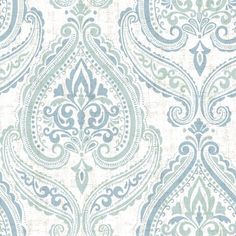 a blue and white wallpaper with an ornate design