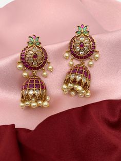 Red Kemp Matte Finish Jhumki Ruby Meenakari Jhumkas For Festivals, Diwali Ruby Meenakari Jhumkas, Multicolor Jhumkas With Zari Work For Diwali, Heavy Ruby Jhumkas For Festive Occasions, Festive Heavy Ruby Jhumkas, Ruby Bollywood Jhumkas For Festivals, Bollywood Ruby Jhumkas For Festivals, Navratri Multicolor Jhumkas With Zari Work, Bollywood Ruby Jhumkas With Latkans