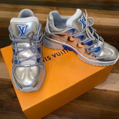 Blue & Silver Lv Sneakers Luxury Metallic Sneakers For Streetwear, Luxury Silver Sneakers With Metallic Logo, Luxury Silver Custom Sneakers, Designer Metallic Low-top Sneakers, Blue Louis Vuitton, Lv Sneakers, Louis Vuitton Sneakers, Shoes Silver, Louis Vuitton Shoes