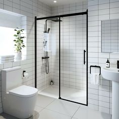 a bathroom with a toilet, sink and shower