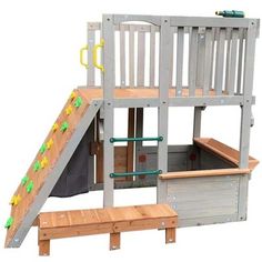 a wooden play set with a slide and storage bins for children to climb on