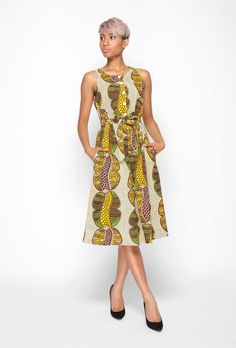 "This sleeveless A - line shaped print dress, is made with quality Dutch Hollandaise Cotton print, also known as African print. It features, front upper bodice button stand, inverted pleat bottom skirt, side pockets, elastic waist with self tie belt. Dress length falls below knee length.  A timeless trans-seasonal cocktail dress suitable for all occasions. Made In Australia. Model wears a size: S and is 5ft 6\" tall Fabric:  100% Cotton Care: Cold hand wash with mild soap. Do not bleach/soak or Summer Cotton Dress With All Over Print, Casual Sleeveless Maxi Dress With Abstract Print, Sleeveless Floral Print Midi Dress For Work, Sleeveless All Over Print Dress, Sleeveless Midi Dress With Floral Print For Work, Patterned Sleeveless Printed Dress, Sleeveless Patterned Dress With Abstract Print, Casual A-line Dress With Abstract Print, Sleeveless Spring Dresses With All Over Print