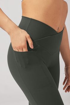 We took the crisscross waistband of your most viral legging and paired it with the leg-lengthening silhouette of our best-selling flares and added POCKETS! And the best part? These pockets have a bonded edge, making them so sleek and nearly invisible. With a pinch-free waistband to accentuate your hourglass figure, a V-booty back seam to lift, and of course our anti-cameltoe front panel for ultimate comfort, this squat-proof flared legging will be your BFF to the gym, on hot girl walks, and even Flare Legging, Black Yoga Pants, Boy Outerwear, Flared Leggings, Girls Outerwear, Leggings With Pockets, Simple Background Images, Simple Background, Fashionable Outfits