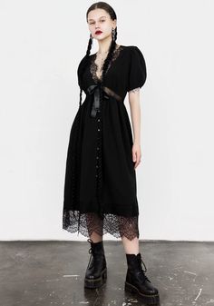 Mark the grave- Black midi dress with sheer lace panelling   - Classically flattering fit ‘n’ flare shape  - Short puff sleeves with elasticated hems for added volume - Lace-trimmed deep V-neck & hems  - Sheer lace waist panel follows the line of the underbust to emphasise your shape - Satin bow between neckline an Lace Button, Black Midi, Lace Crop Tops, Satin Bow, Grunge Style, Black Midi Dress, Sheer Lace, Deep V Neck, The Line