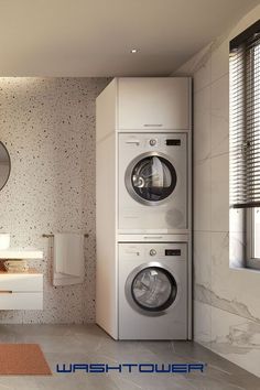 a washer and dryer in a bathroom next to each other