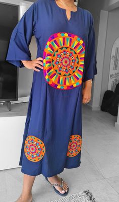 An elegant summer dress/kaftan with Saharan floral patterns. The texture of the Egyptian cotton gives the The beautiful saharan floral patterns on this navy blue kaftan give your summer outfit a dash of exotic opulence together with a sturdy fabric quality.  With its straight design bust to waist ratio of 1:1 its is sure to give the relaxed feel of almost wearing the lightest of dresses. A new look for your summer where this dress/kaftan takes you everywhere from the beach to summer night parties to even casual day errands.  Fabric: 90% Egyptian Cotton-20% polyester Egyptian cotton is extraordinary - producing extra-long fibres that are smaller in diameter than regular cotton. These longer, finer fibres create super smooth yarns when combed and spun, and therefore super smooth, soft cloth Summer Night Party, Blue Kaftan, Summer Dress For Women, Kurti Embroidery, Elegant Summer Dresses, Cotton Summer Dress, Dress Kaftan, Embroidery On Kurtis, Kurti Embroidery Design