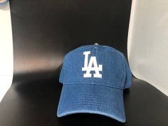 Dodgers Hat, adult adjustable NEW WITH TAG, Russell Athletic 100% Cotton, dad hat, curved bill, unstructured. More hat info: Casual Trucker Hat For Baseball Season, Casual Streetwear Hats For Baseball Season, Casual Trucker Hat With Letter Print And Flat Bill, Casual Snapback Hat With Curved Visor For Baseball Season, Casual Snapback Cap One Size Fits Most, Casual Snapback Cap One Size, Casual Snapback Hat One Size, Casual Baseball Season Cap, Casual Snapback Cap