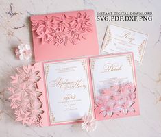 pink and gold wedding stationery with paper flowers on the front, inside and out