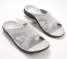 Make the most out of the long lazy days of summer wearing this sporty mesh sandal equipped with outsole technology and arch support. This slide goes from beach to boardwalk to bistro -- and beyond -- in sun-kissed style and all day comfort. From Revitalign. Breathable Comfortable Slip-on Sandals, Comfortable Lightweight White Sport Sandals, Breathable Gray Slip-on Sandals, Gray Sport Sandals For Beach And Summer, Lightweight White Sandals With Arch Support, Gray Slip-on Sandals With Arch Support, Summer Gray Cushioned Sport Sandals, Gray Cushioned Sport Sandals For Summer, Comfortable Gray Sandals With Arch Support