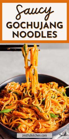 a pan filled with noodles and sauce on top of a wooden table