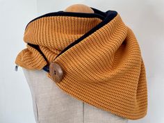 Cuddly warm and simply chic - scarf This wrap scarf is wonderfully soft and cuddly. On the front, a beautiful knitted fabric in warm yellow was combined with a cozy fleece fabric.  The scarf is wrapped twice around the neck and closed with a beautiful wooden button. Yellow Winter Scarf, One Size, Yellow Winter Scarf One Size, Chic Scarf, Chic Scarves, Warm Yellow, Loop Scarf, Simply Chic, Wrap Scarf, Fleece Fabric