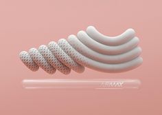 a pink background with a white object in the middle that is shaped like a spiral