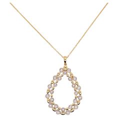 This pear shaped necklace is a gorgeous statement on any neck! The double pear is an open design that has 24 glorious diamonds that are bezel set and alternate with a lovely gold bead. The pendant is flat but 1 5/8 inches long. A drop diamond or gemstone could be added to the center of the pendant if you had a gemstone that you wanted to mount in a pendant. Such a graceful jewelry item! Material: 14K Gold Diamond Count: 24 Diamond Weight: .16 carats Diamond Clarity: VS-2 Diamond Color: G-H Measu Pear-shaped Diamond Necklace, Pear-shaped Yellow Gold Diamond Necklace, Fine Jewelry Teardrop Necklace With Rose Cut Diamonds, Anniversary Rose Cut Diamond Teardrop Pendant Necklace, Yellow Gold Pear-shaped Necklace With Rose Cut Diamonds, Teardrop Rose Cut Diamond Necklace, Yellow Gold Pear-shaped Rose Cut Diamond Necklace, Pear-shaped Drop Necklace With Diamond Accents, Anniversary Teardrop Pendant Necklace With Rose Cut Diamonds