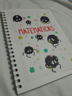 an open notebook with stickers on it that says matentaicas in spanish