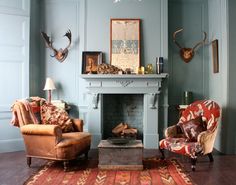 a living room filled with furniture and a fire place