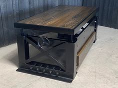 an industrial style coffee table with wheels on it