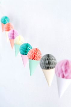 paper cones are lined up on a string