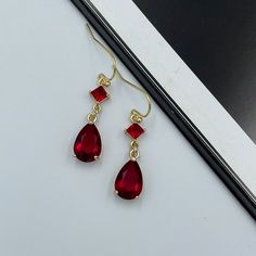 Dainty Ruby Red Thread Earrings, Dark Red Teardrop Earrings, Statement Ruby Red Drop Earrings, Long Red Dangle Earrings, Red Dangle Earrings. These are simple and beautiful red teardrop crystal earrings. Red crystals are framed in bright gold and dangling from gold plated French wire. Measurements: The total length from the top of the hook to bottom - 1.37 inches (35mm) approximately. Teardrop crystal: 12 mm x 7 mm The earrings would be a PERFECT GIFT for you and your family and friends! Click h Ruby Dangle Earrings, Red Teardrop Earrings, Ruby And Gold Earrings, Red Drop Crystal Earrings As Gift, Elegant Red Drop Crystal Earrings, Red Drop Earrings For Pierced Ears, Red Teardrop Earrings For Formal Occasions, Red Drop Crystal Earrings For Evening, Elegant Red Crystal Earrings