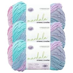 three skeins of yarn in blue, pink and purple colors on a white background