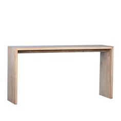 a wooden table sitting on top of a white wall