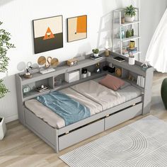 a bedroom with a bed, desk and shelves on the wall next to each other