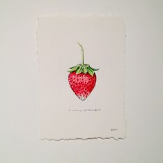 a piece of paper with a drawing of a strawberry on it