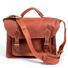 Matias Briefcase - 100% oil-tanned leather Interior design of 2 large sections and 1 small front pocket Exterior design with two buckled closures Measures 13“H x 15“W x 5“D Shoulder strap with buckle design for adjustable length of 18“ to 22” Handcrafted in Honduras This is a handmade leather item, and by nature, there wi Leather Interior Design, Leather Messenger Bag Laptop, Laptop Messenger Bags, File Folders, The Don, Be Natural, Leather Laptop, Leather Briefcase, Eco Fashion