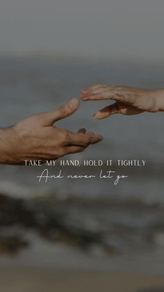 two hands reaching out towards each other with the words take my hand hold it tightly