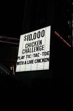 a lighted sign that reads $ 10, 000 chicken challenge play tic - tac - toe with a live chicken