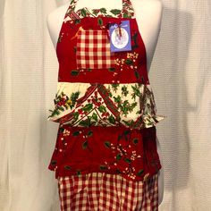 a red and white apron on a mannequin